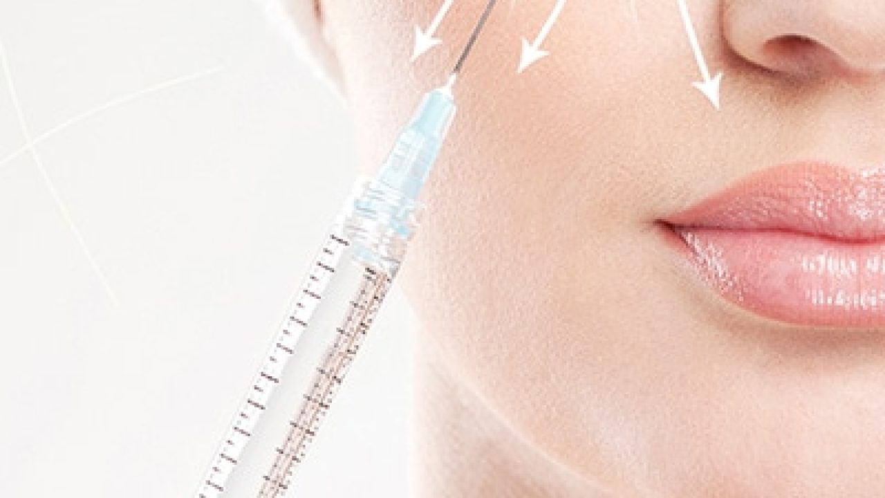 Beautiful face and the syringe (plastic surgery and botox injection concept)
