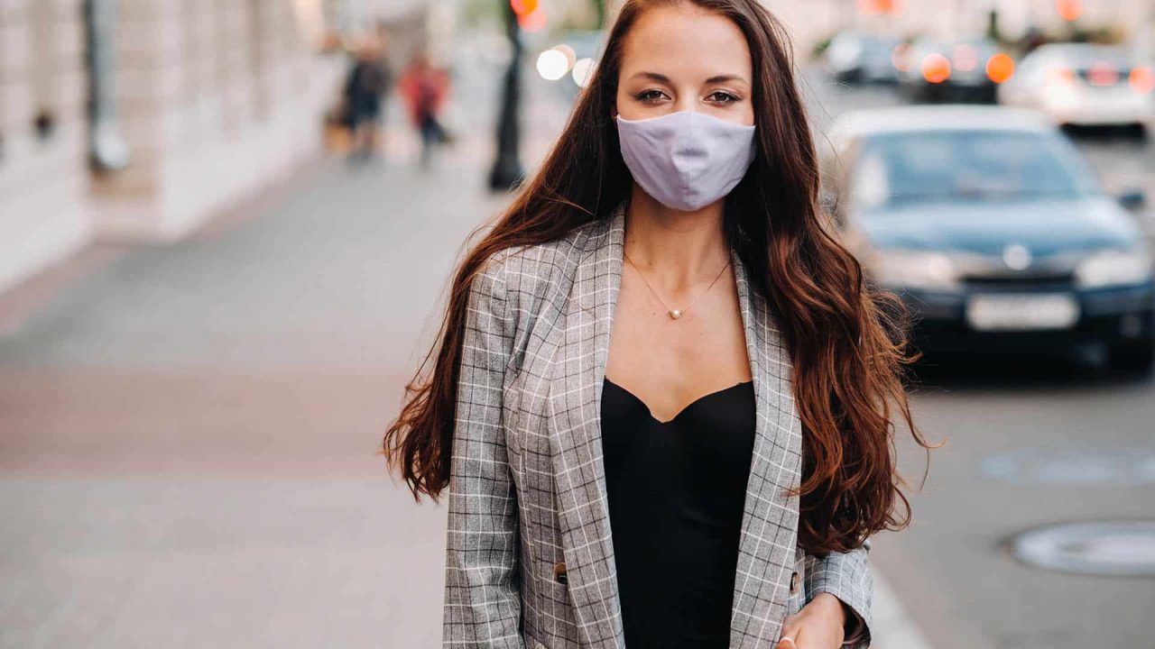 a beautiful woman with a face mask