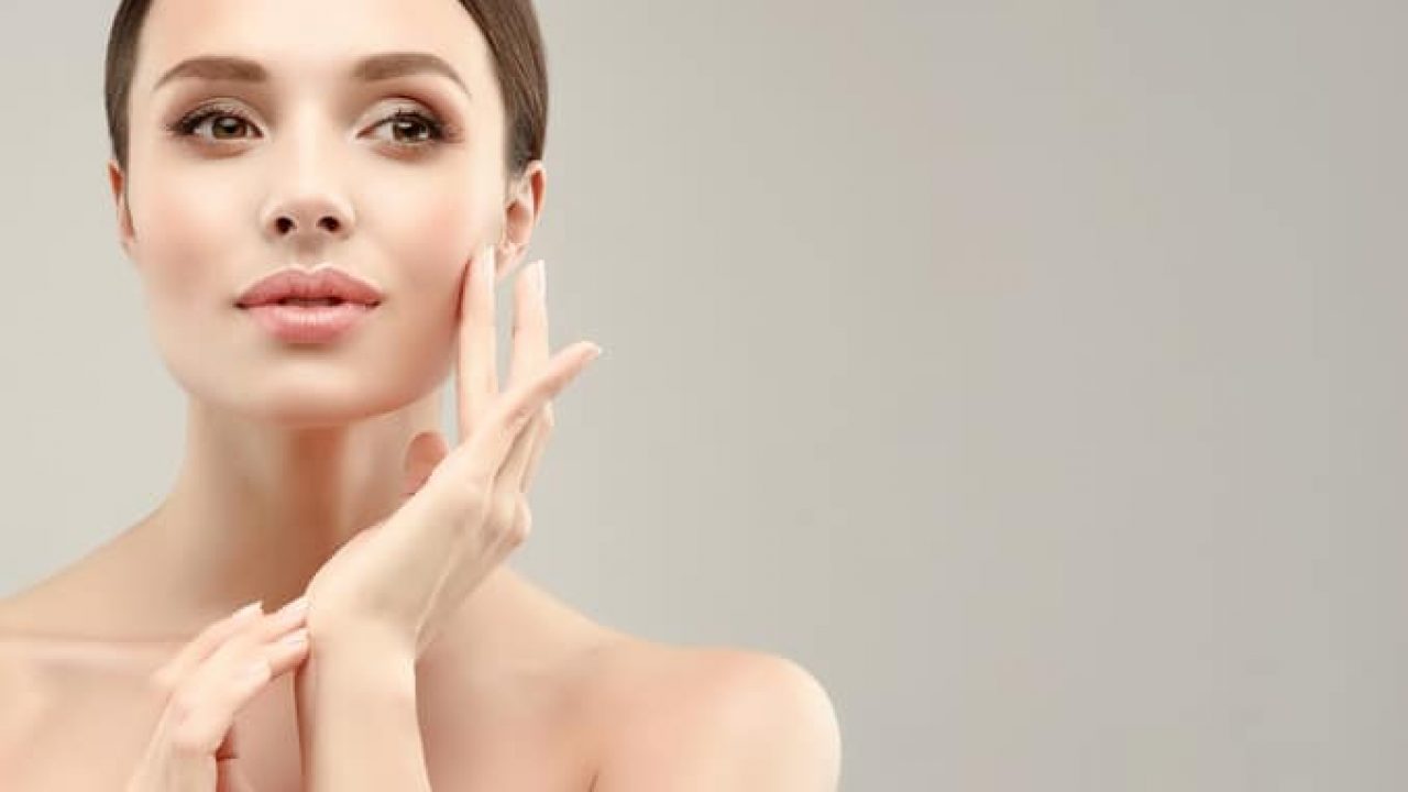 Gorgeous, young, blonde haired woman with clean fresh skin is looking straight on camera by magnetic look