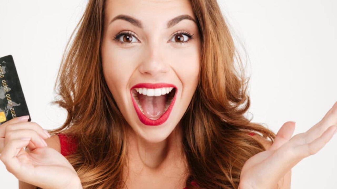 A happy woman with a gift card