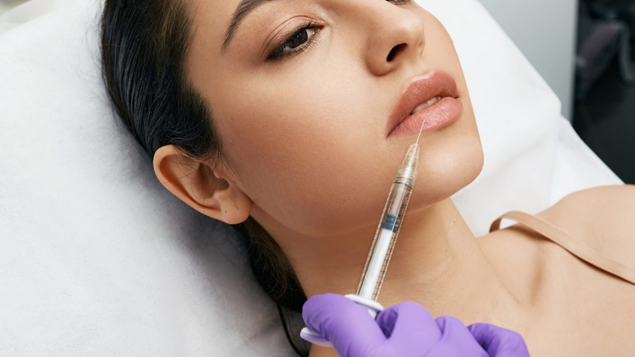 woman getting lip filler treatment