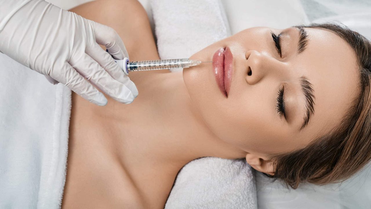 woman receives lip fillers