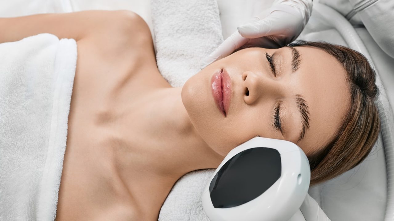 a women getting IPL laser on her face