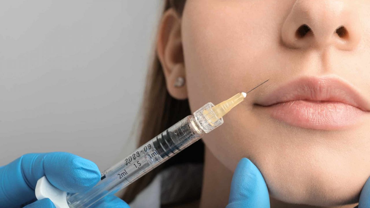 woman getting a facial injection